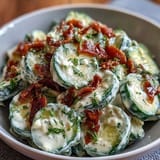 Creamy Cucumber Salad with Dill and Greek Yogurt, featuring crisp cucumbers in a tangy, herb-flecked dressing.  