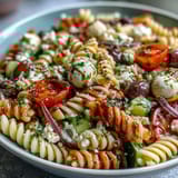 A refreshing Easy Summer Pasta Salad with Italian Dressing, featuring al dente pasta, vibrant veggies, and creamy mozzarella, tossed in tangy Italian dressing for a light meal.