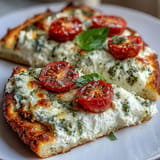 Enjoy this easy Viral Cottage Cheese Flatbread, golden brown, topped with basil.