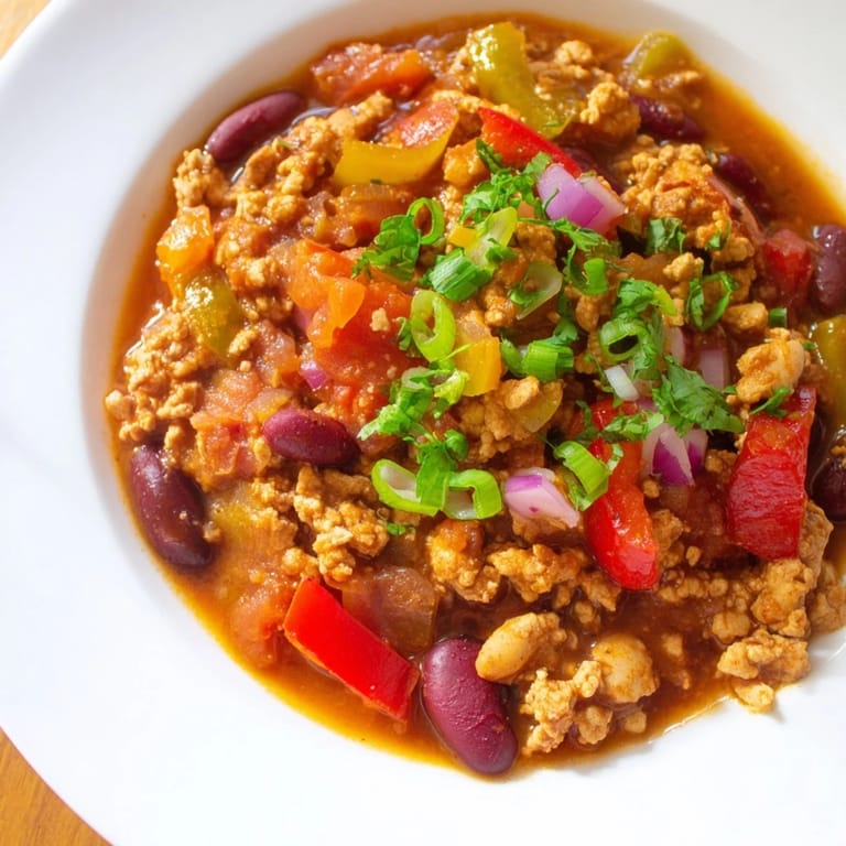 Delicious, homemade turkey chili, served hot with optional toppings, perfect for dinner.