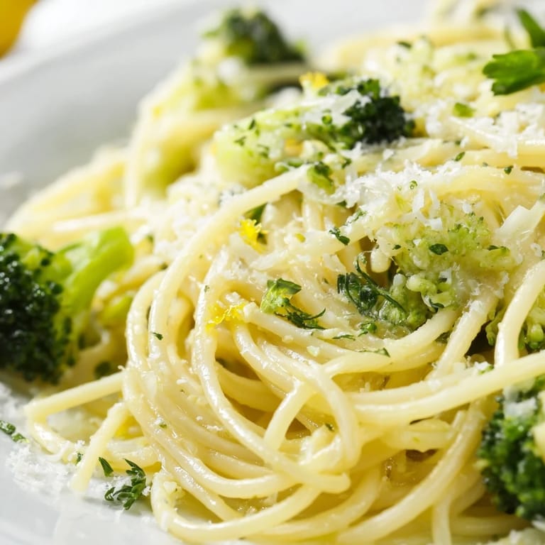 Quick One-Pot Lemon Broccoli Pasta served in a rustic bowl with a lemon wedge, ideal for an easy weeknight dinner.