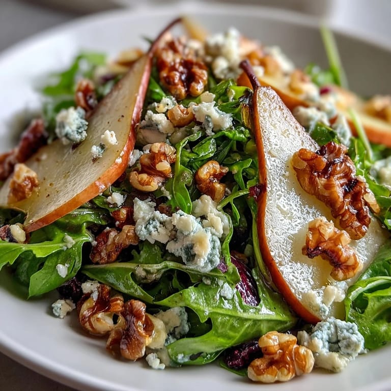 Arugula and Pear Bowl salad dressed with balsamic vinaigrette, ready to serve as a light vegetarian dinner.